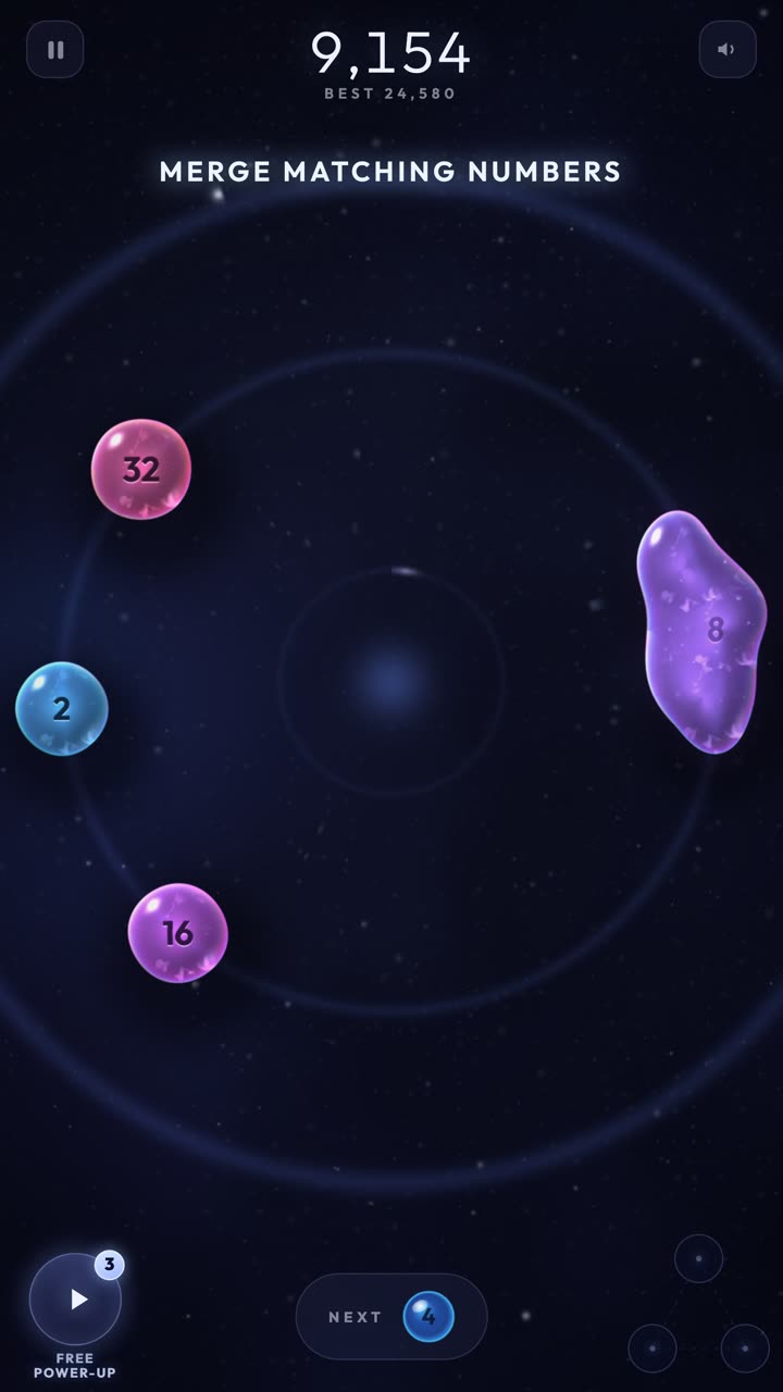 DOUBLE IT gameplay: liquid orbs merging on the orbital ring